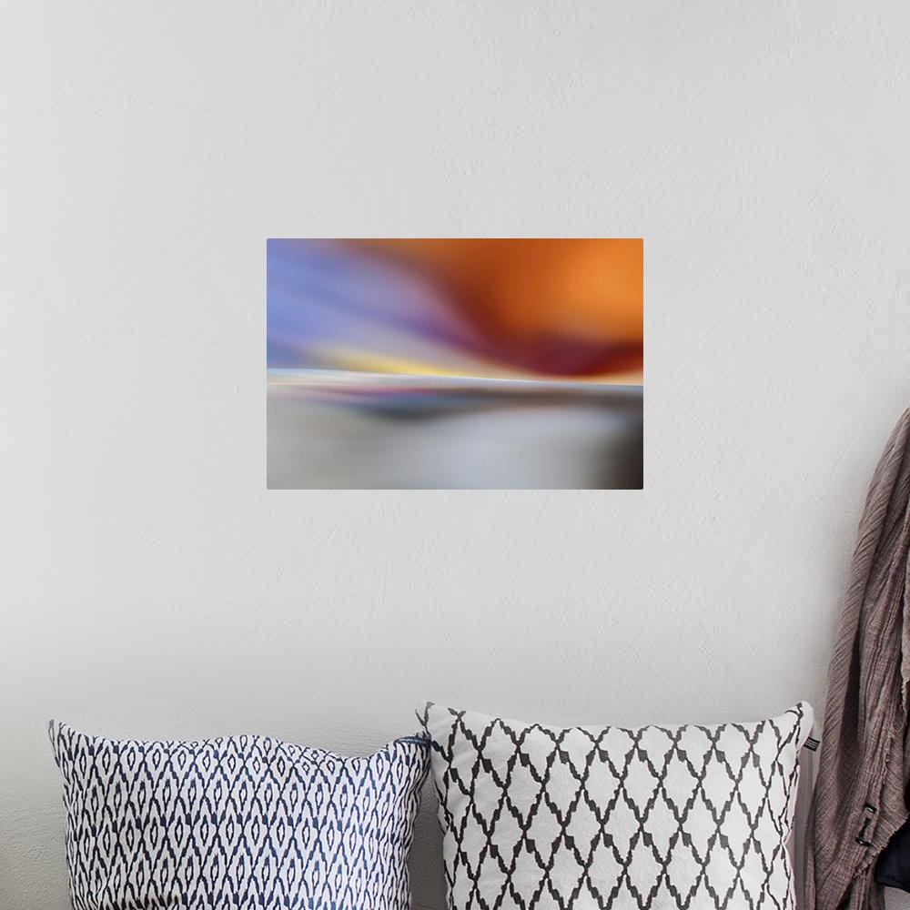 A bohemian room featuring Abstract representation of a sunset on a white beach.