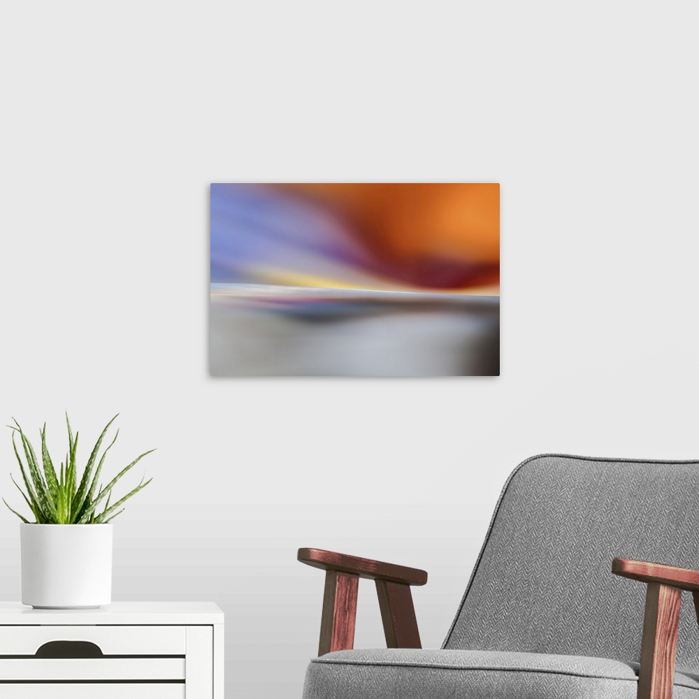 A modern room featuring Abstract representation of a sunset on a white beach.