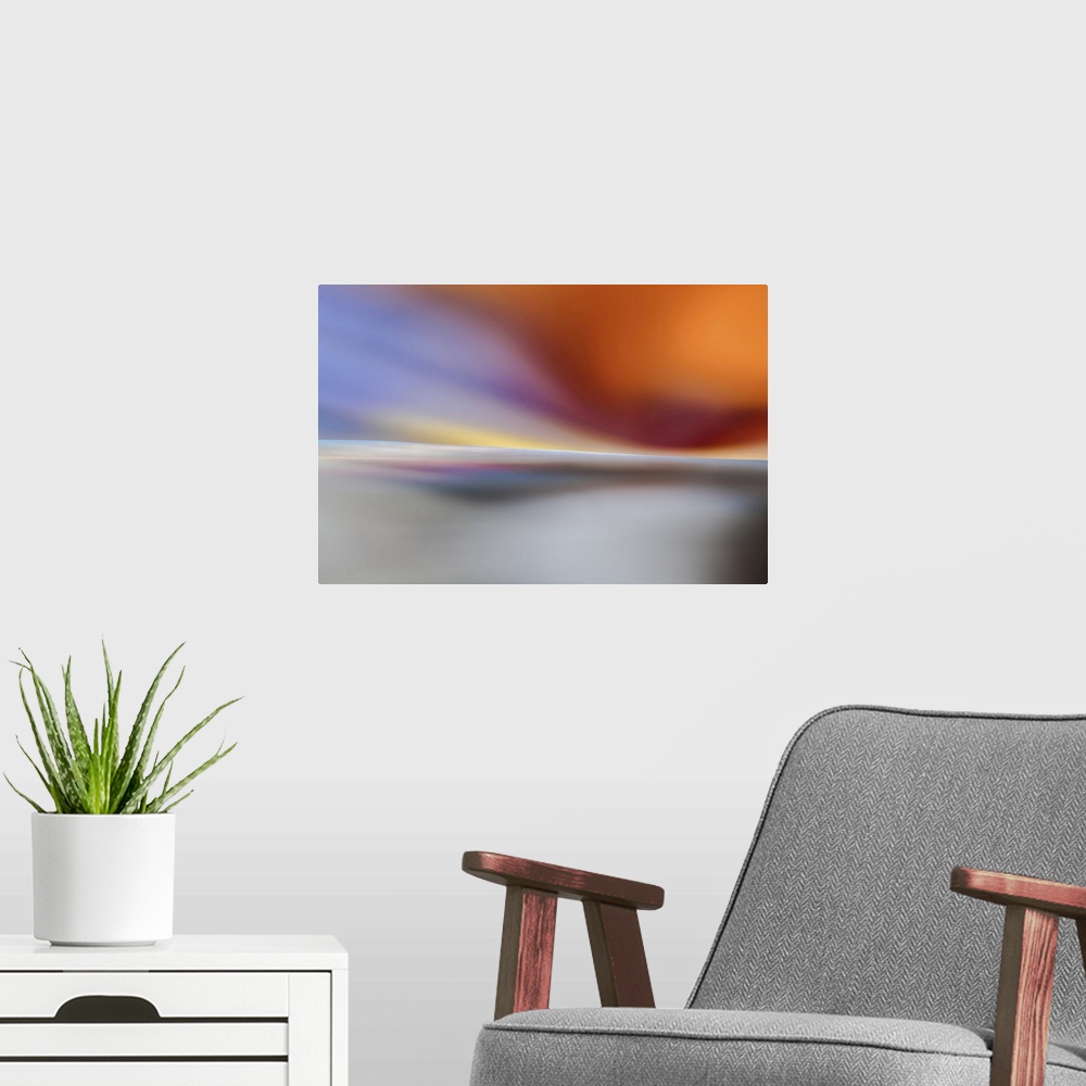 A modern room featuring Abstract representation of a sunset on a white beach.