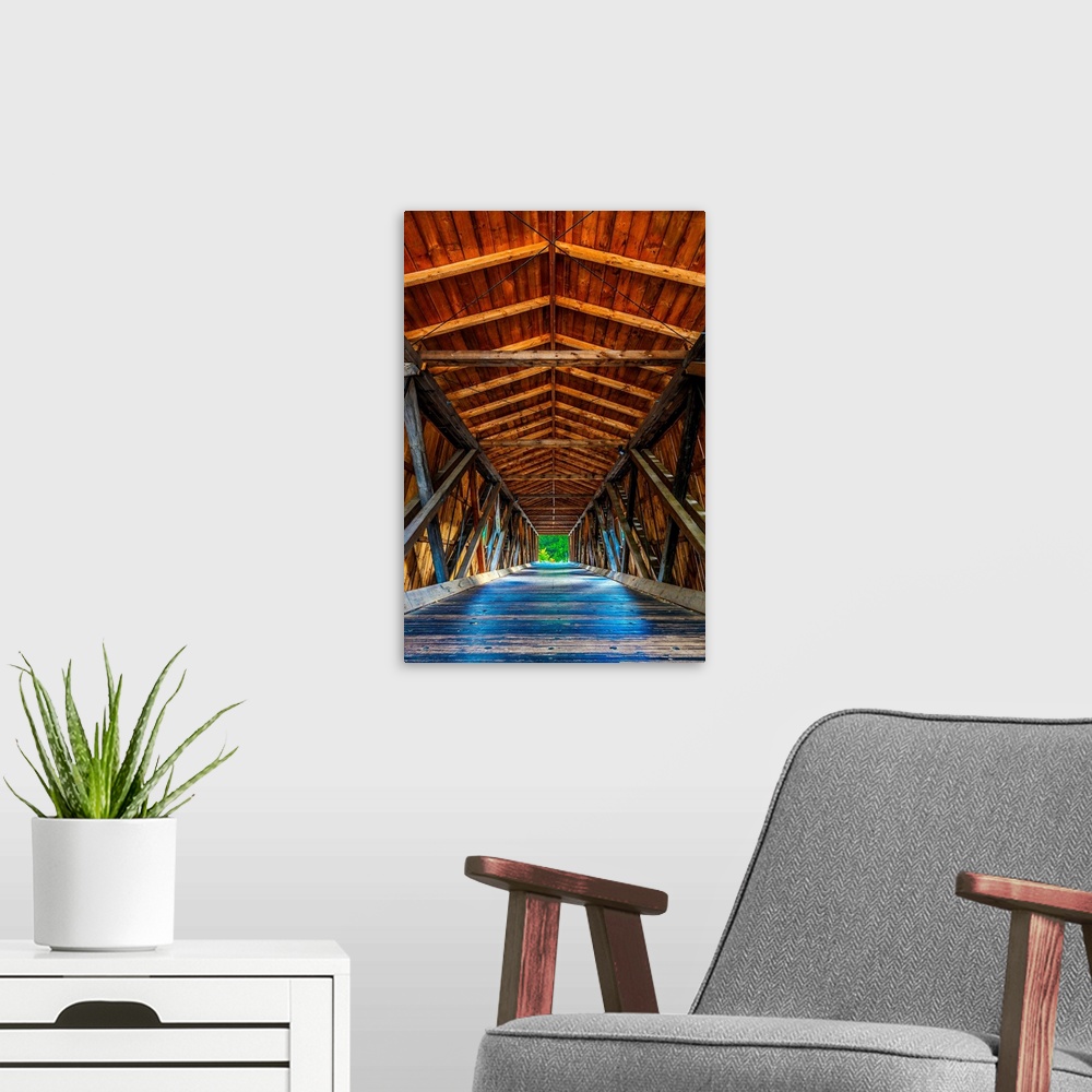A modern room featuring Wooden beams and ceiling of a covered bridge in the Adirondacks, New York.