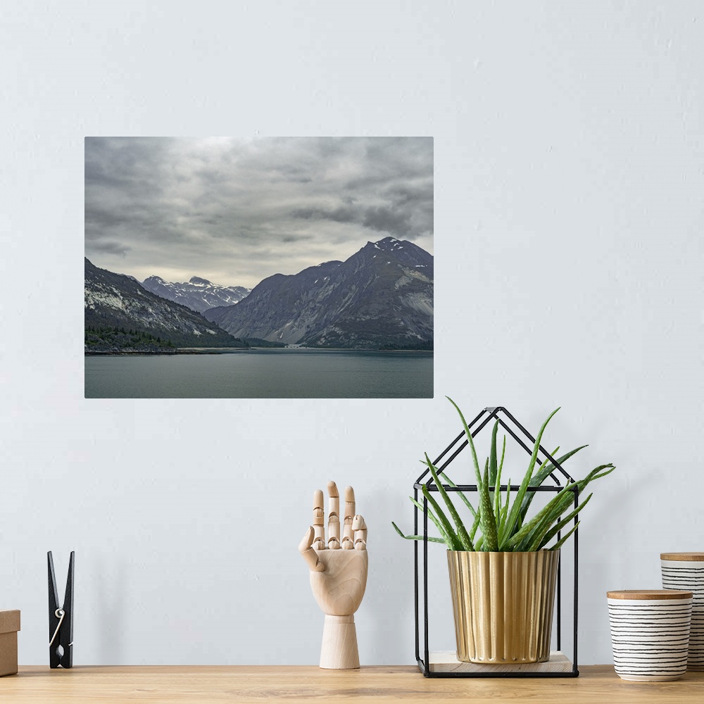 A bohemian room featuring Soft unsaturated colors grace this serene and beautiful scene of Alaskan mountains rising above a...