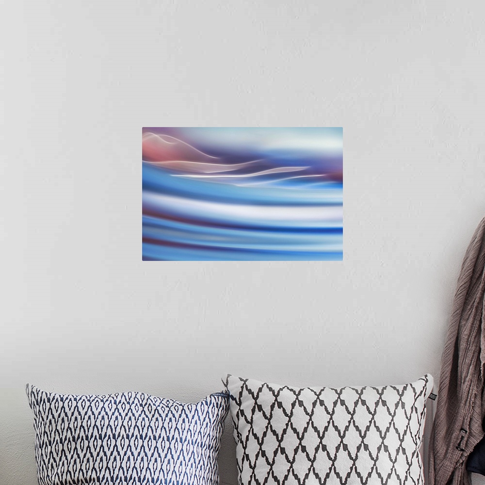 A bohemian room featuring Abstract photo of smooth waves in pastel tones.