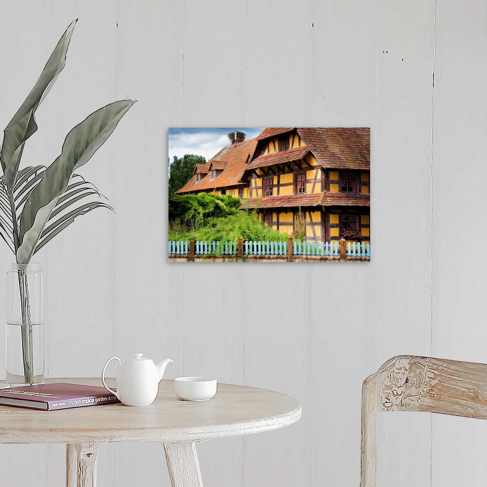 A farmhouse room featuring A photograph of a country cottage.