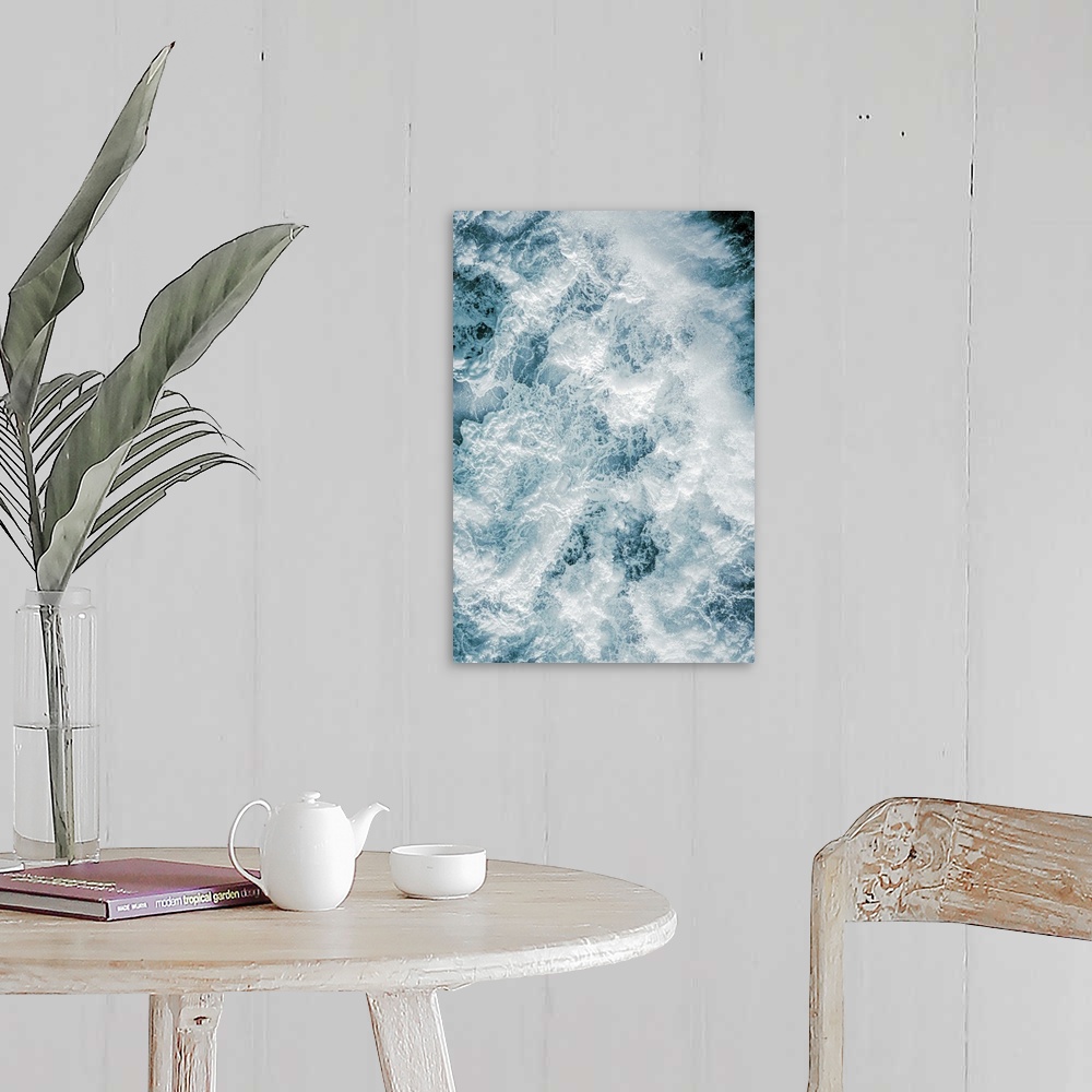 A farmhouse room featuring Aerial photography picture of a huge wave from above showing droplets.
