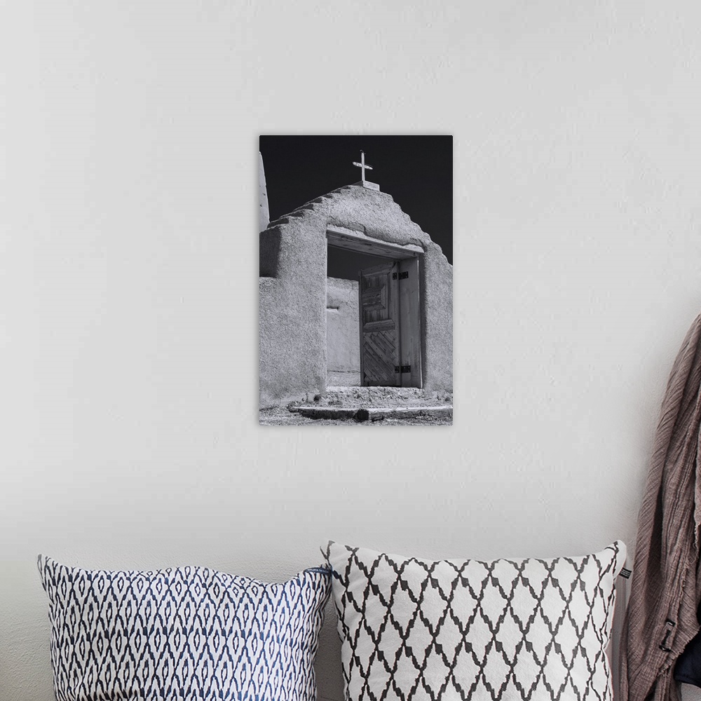 A bohemian room featuring Photograph of a New Mexico adobe church rendered in the style of Ansel Adams.