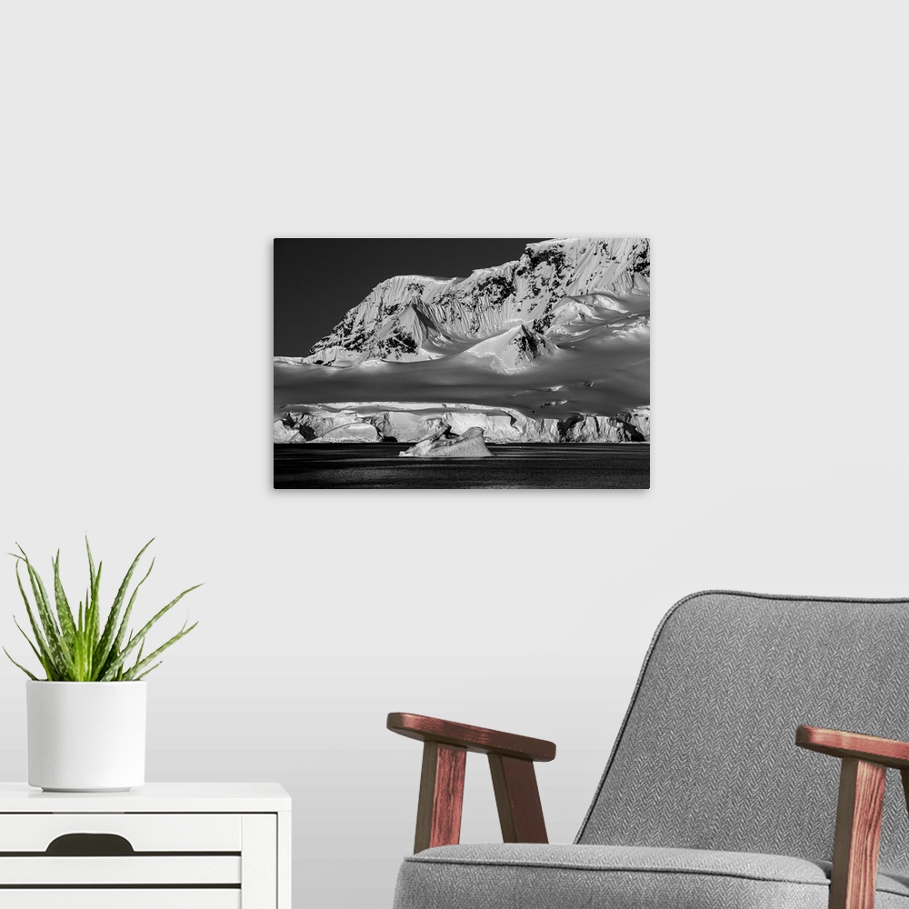 A modern room featuring Black and white photograph of the cold and lifeless looking landscape of Antarctica.