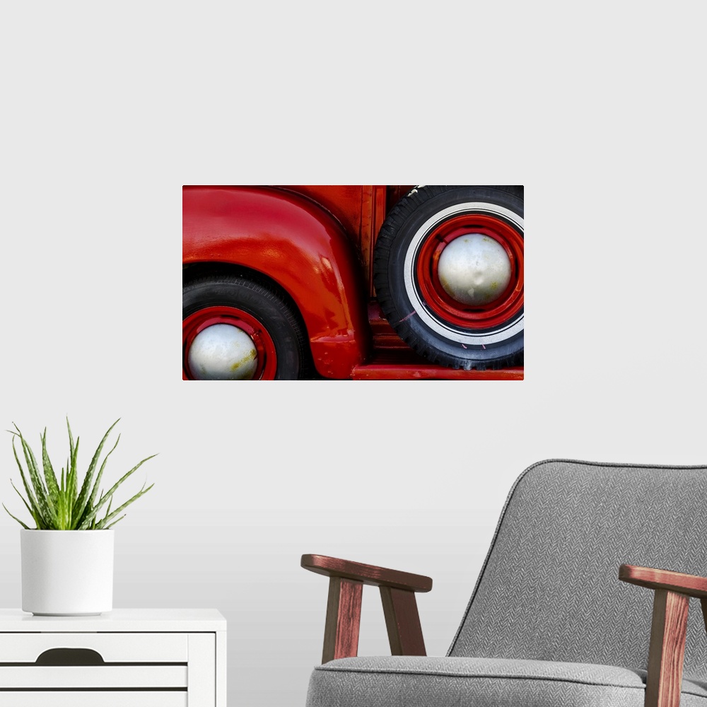 A modern room featuring Abstract geometric image formed by the juxtaposition of curving fenders and round tires with mute...