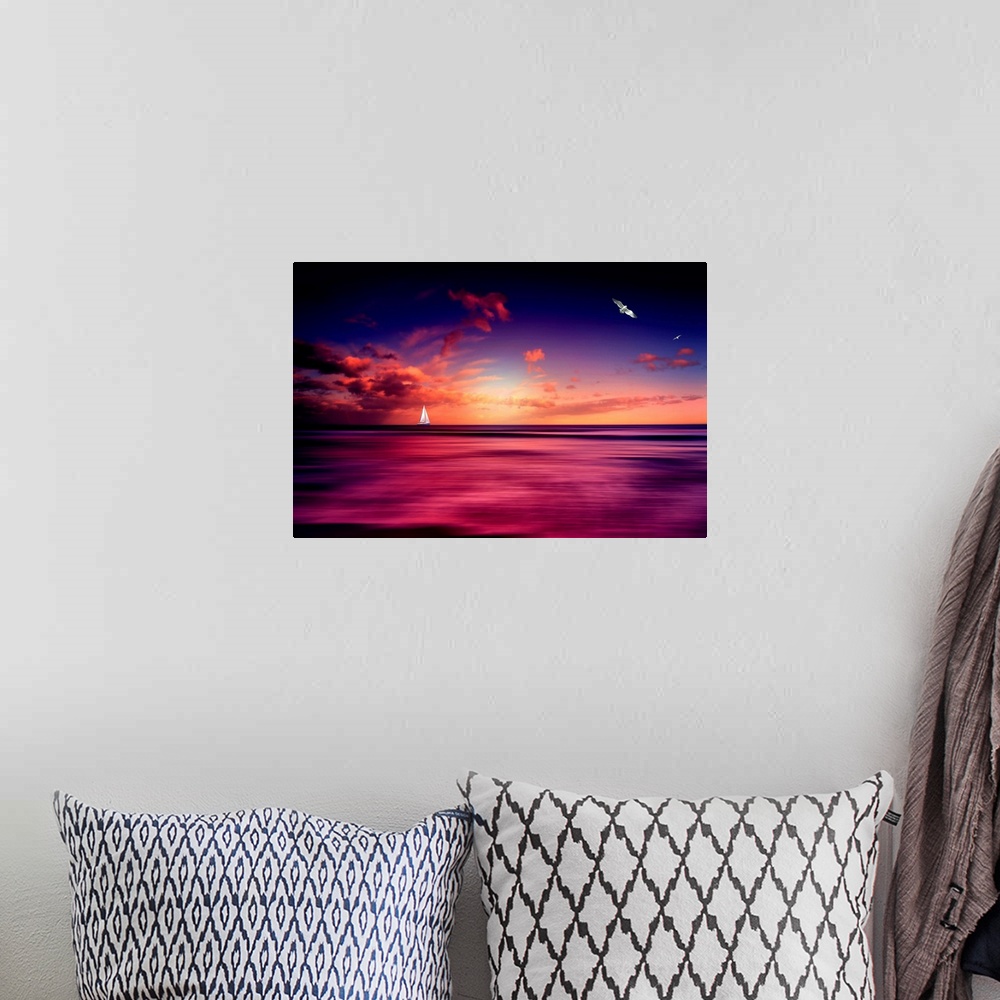 A bohemian room featuring Sunset with a sailboat on the horizon