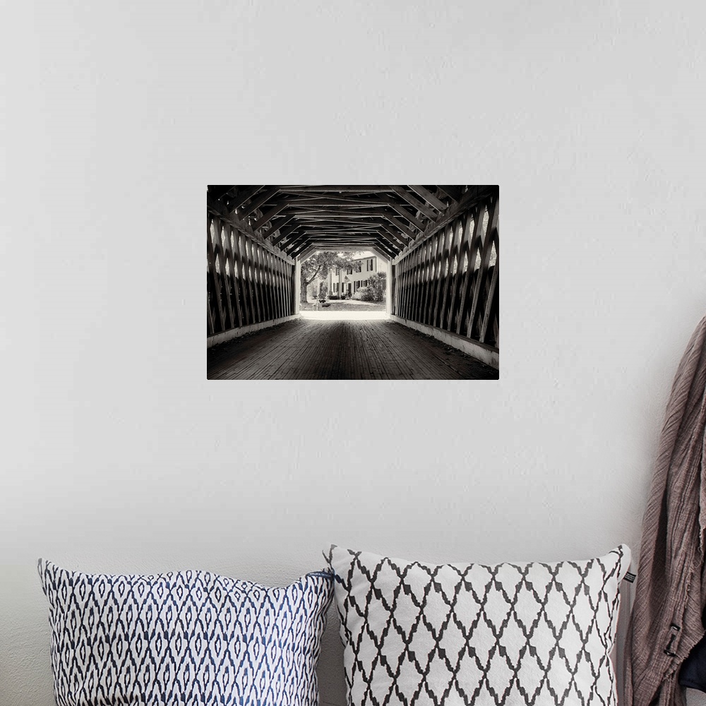 A bohemian room featuring Fine art photo of the inside of a wooden covered bridge, in black and white.