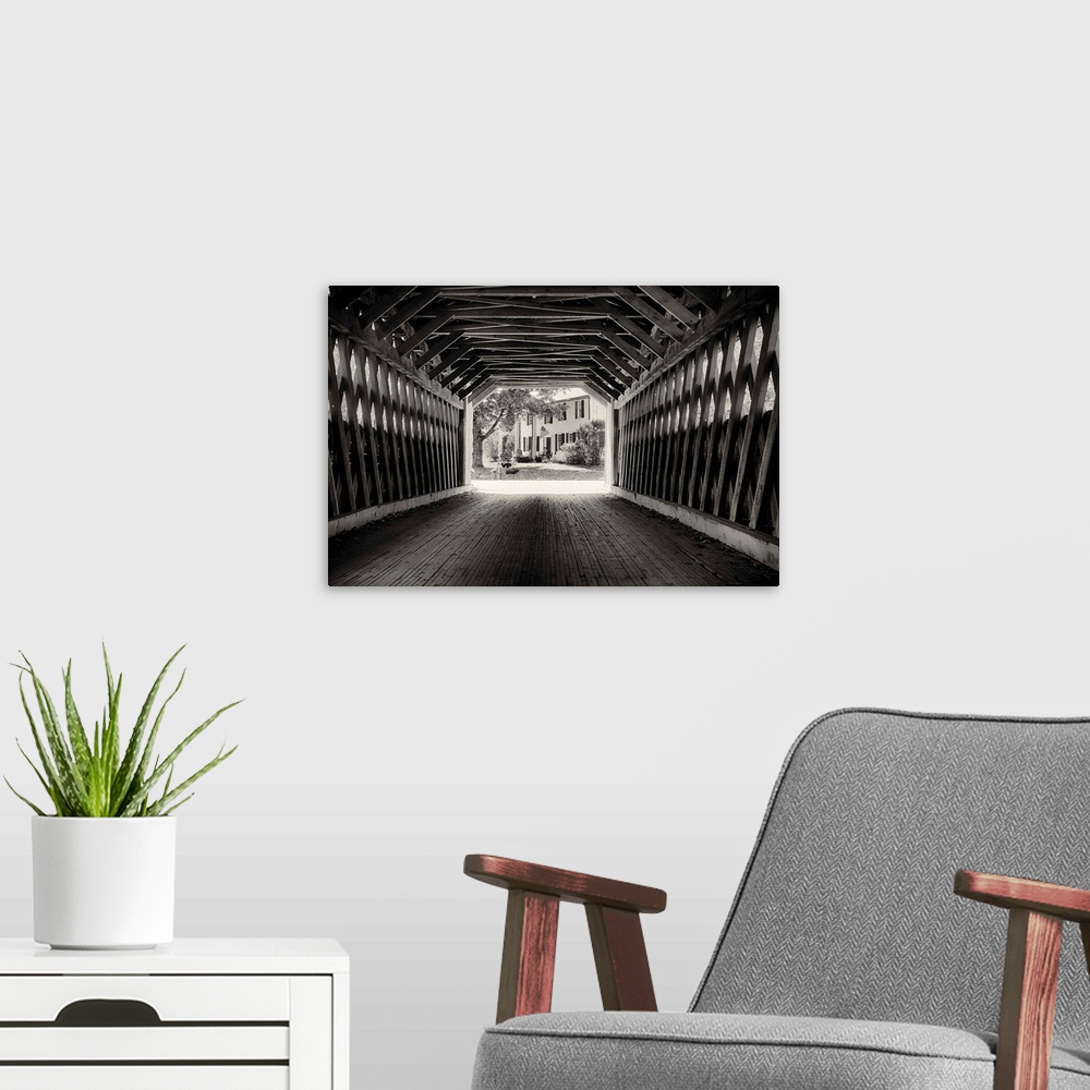 A modern room featuring Fine art photo of the inside of a wooden covered bridge, in black and white.