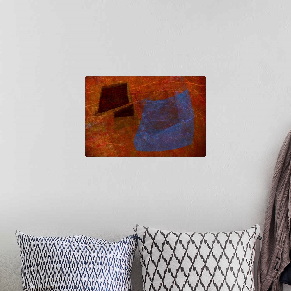 A bohemian room featuring An abstract expressionistic image of textures and shapes in rich reds, blues and purples.