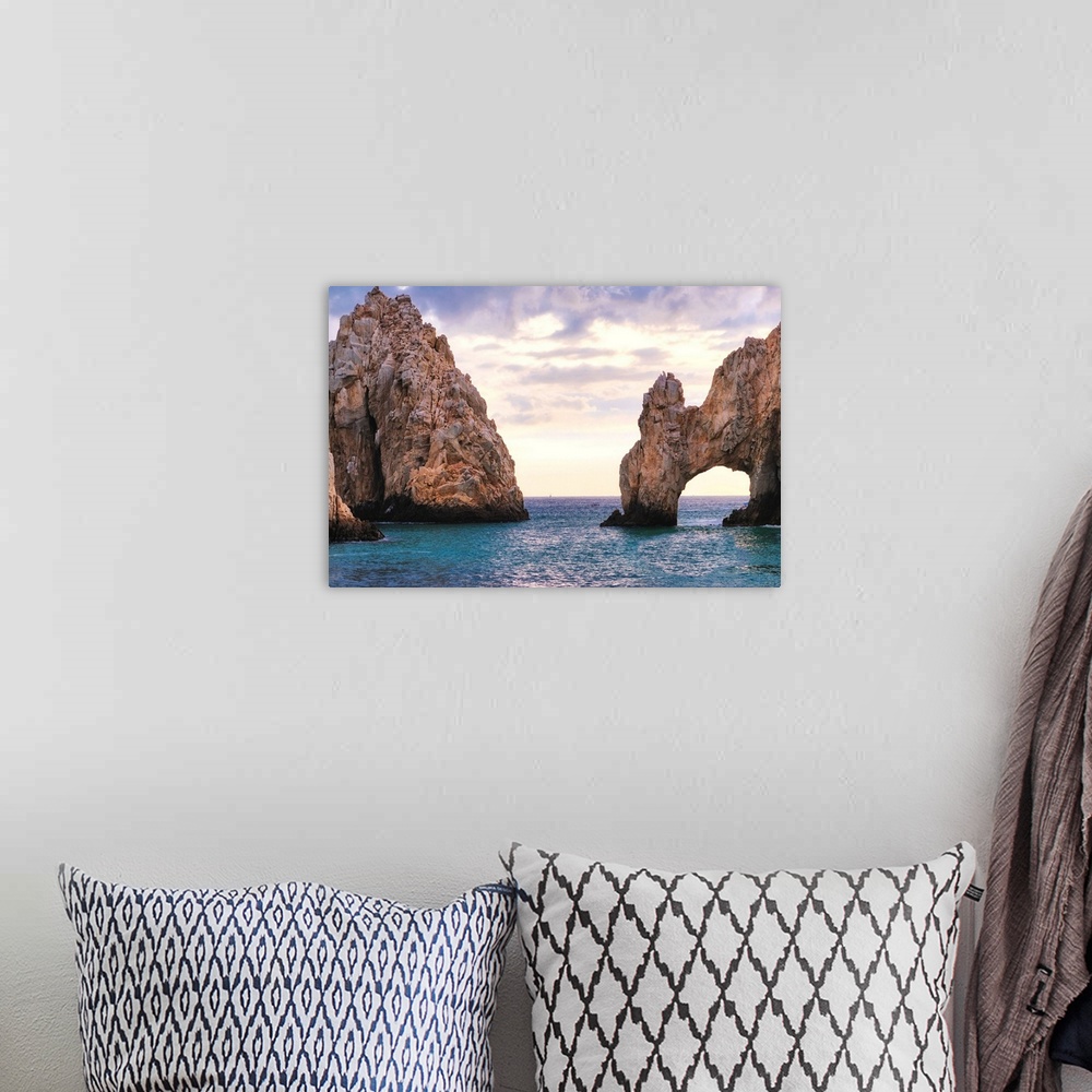 A bohemian room featuring View of the Arch of Cabo San Lucas in late afternoon light, Baja California Sur, Mexico.