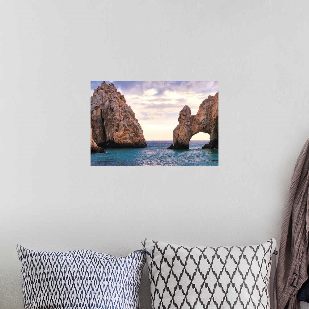 A bohemian room featuring View of the Arch of Cabo San Lucas in late afternoon light, Baja California Sur, Mexico.