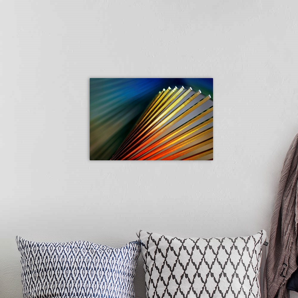 A bohemian room featuring Abstract photo of various colored lines with light shining on them.