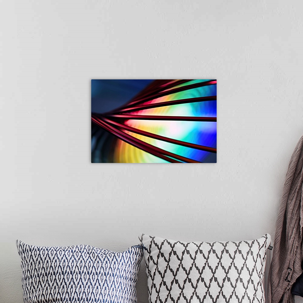 A bohemian room featuring Fine art abstract photograph of cords in front of a rainbow pattern.