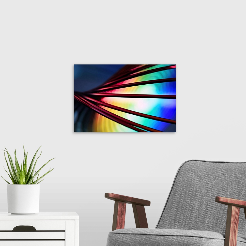 A modern room featuring Fine art abstract photograph of cords in front of a rainbow pattern.