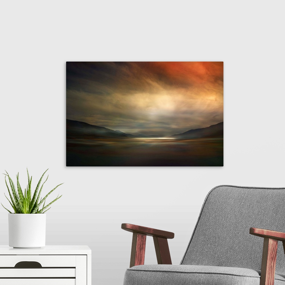 A modern room featuring Fine art photo of a valley dimly lit by glowing clouds at sunset in Canada.