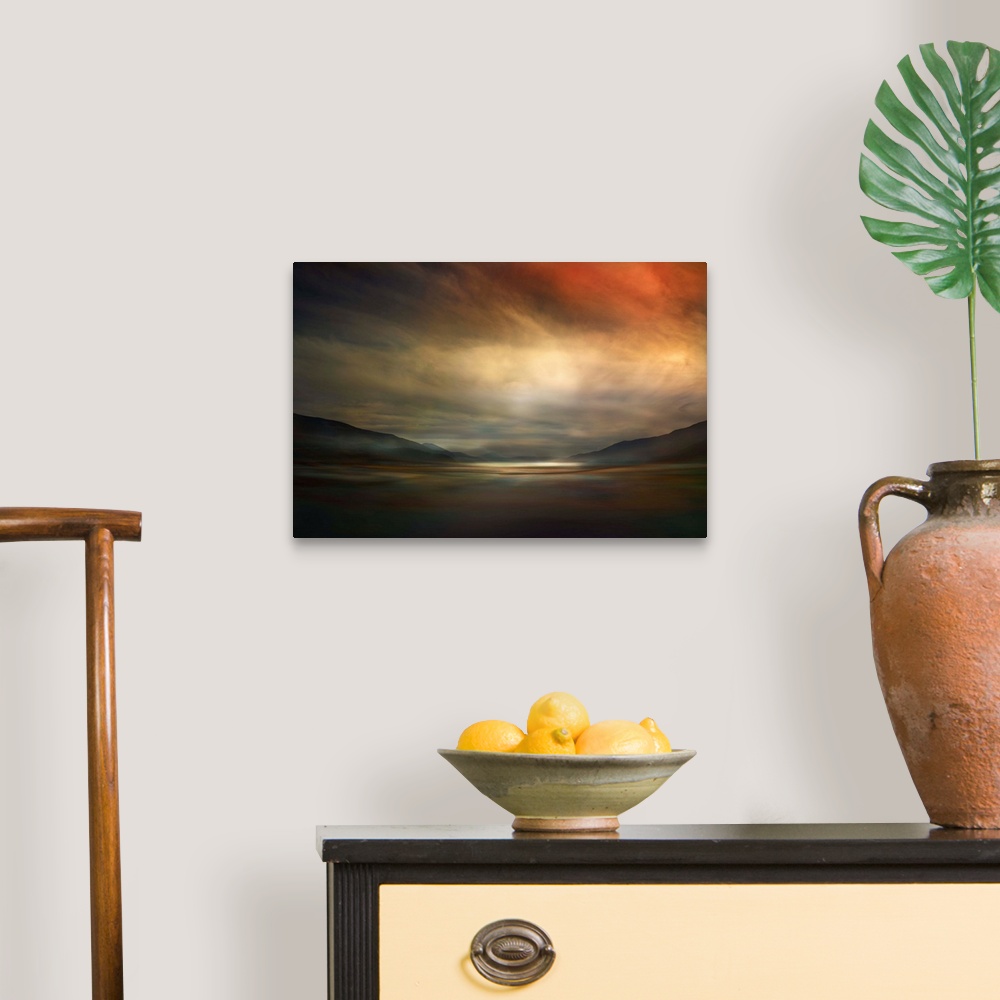 A traditional room featuring Fine art photo of a valley dimly lit by glowing clouds at sunset in Canada.