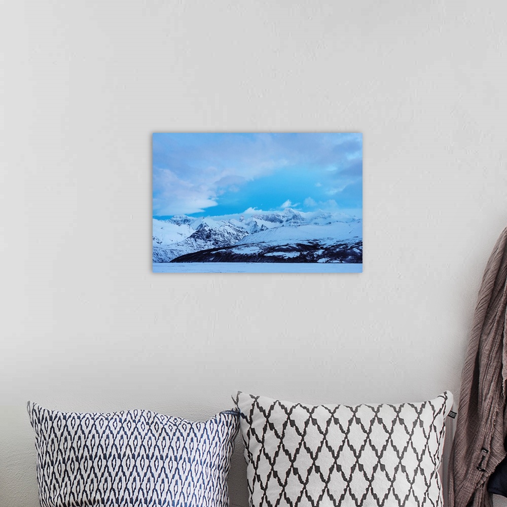 A bohemian room featuring Snowy mountains landscape on blue sky background in Iceland