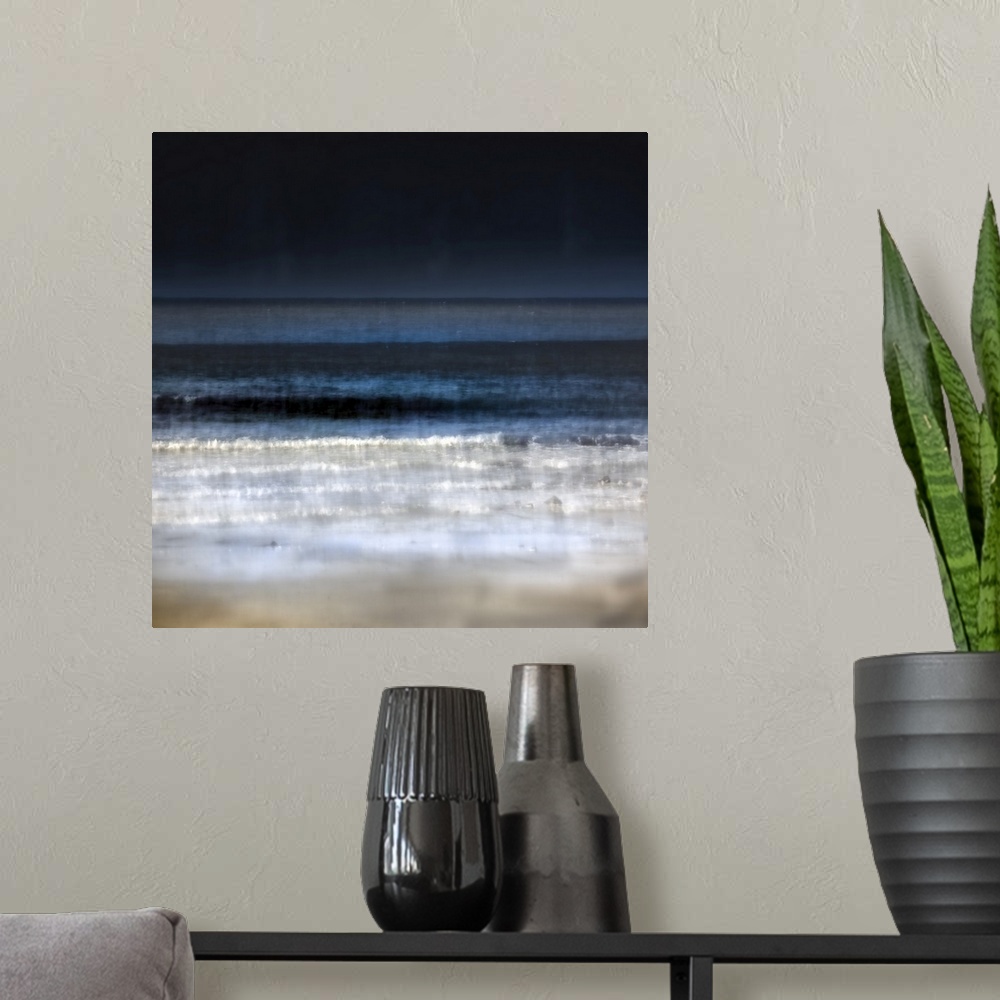 A modern room featuring Minimalist navy blue and white abstract beach scene with dark skies and waves breaking on sand.