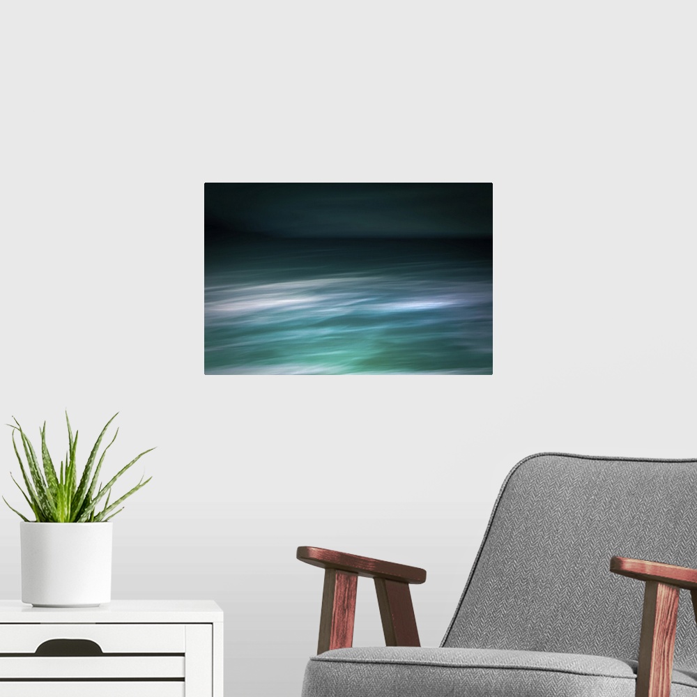 A modern room featuring Modern photography abstract seascape abstract in teal and white with dark sky and waves.