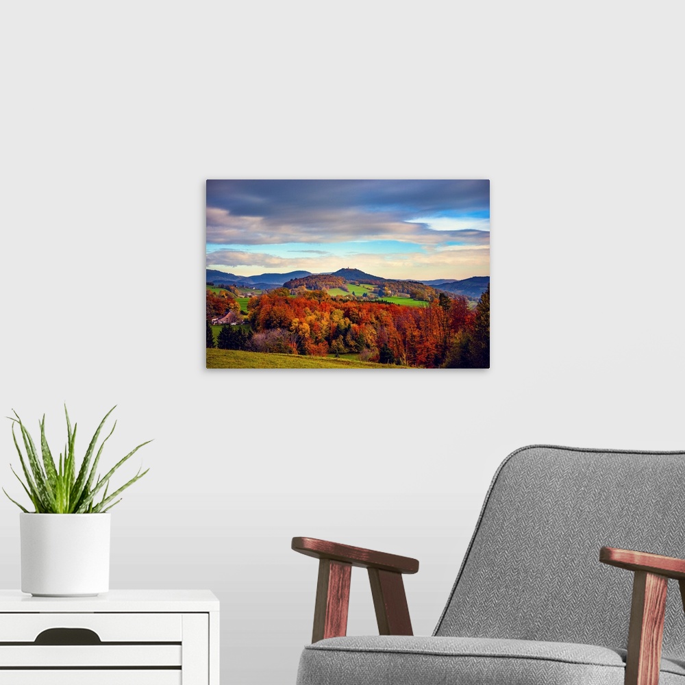 A modern room featuring Hilly landscape in autumn