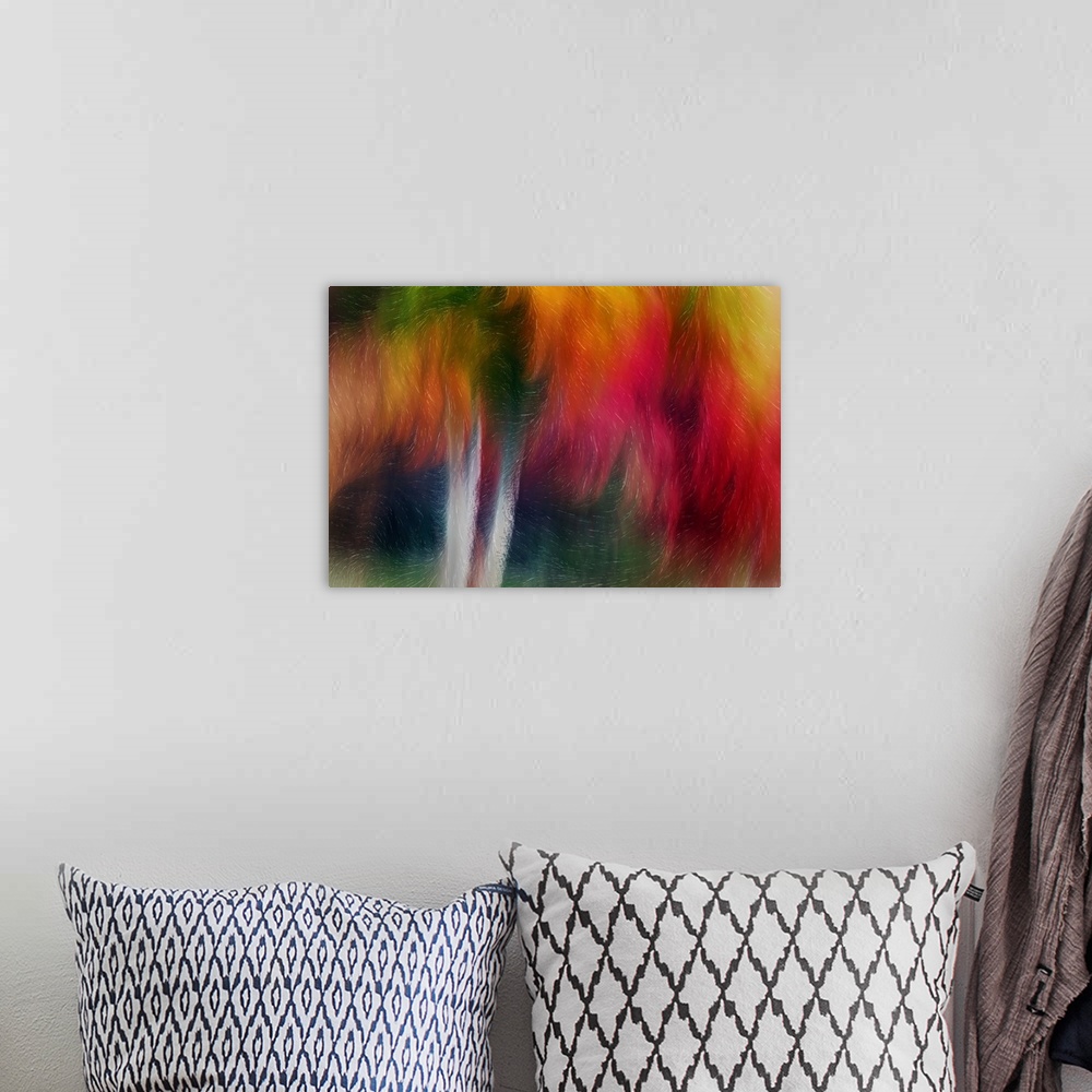 A bohemian room featuring Abstract artwork with swirls of bright colors and lines running throughout over two vertical whit...