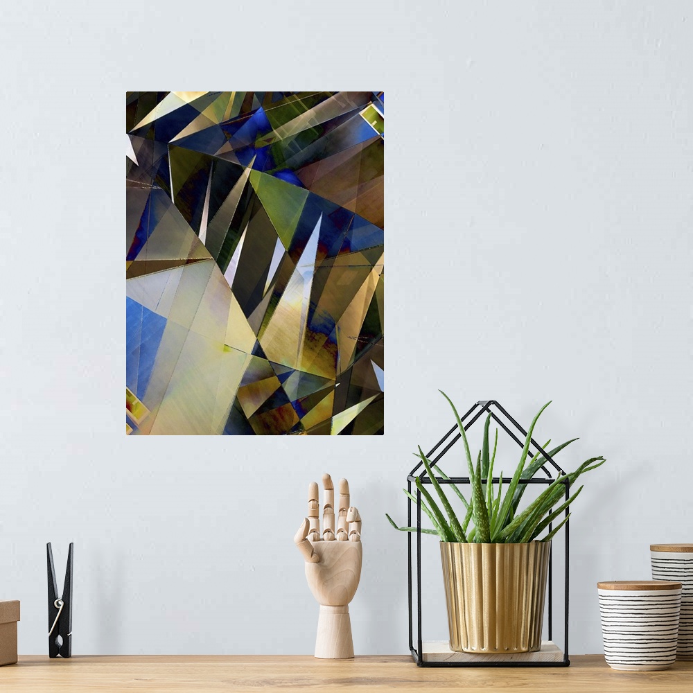 A bohemian room featuring Abstract photograph made of intersecting angles and lines in varying blue and yellow shades.