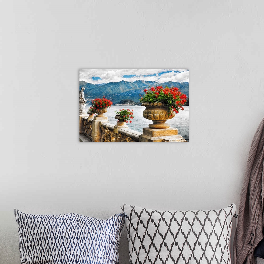 A bohemian room featuring Fine art photo of a stone wall with urns full of blooming flowers, Lake Como, Italy.
