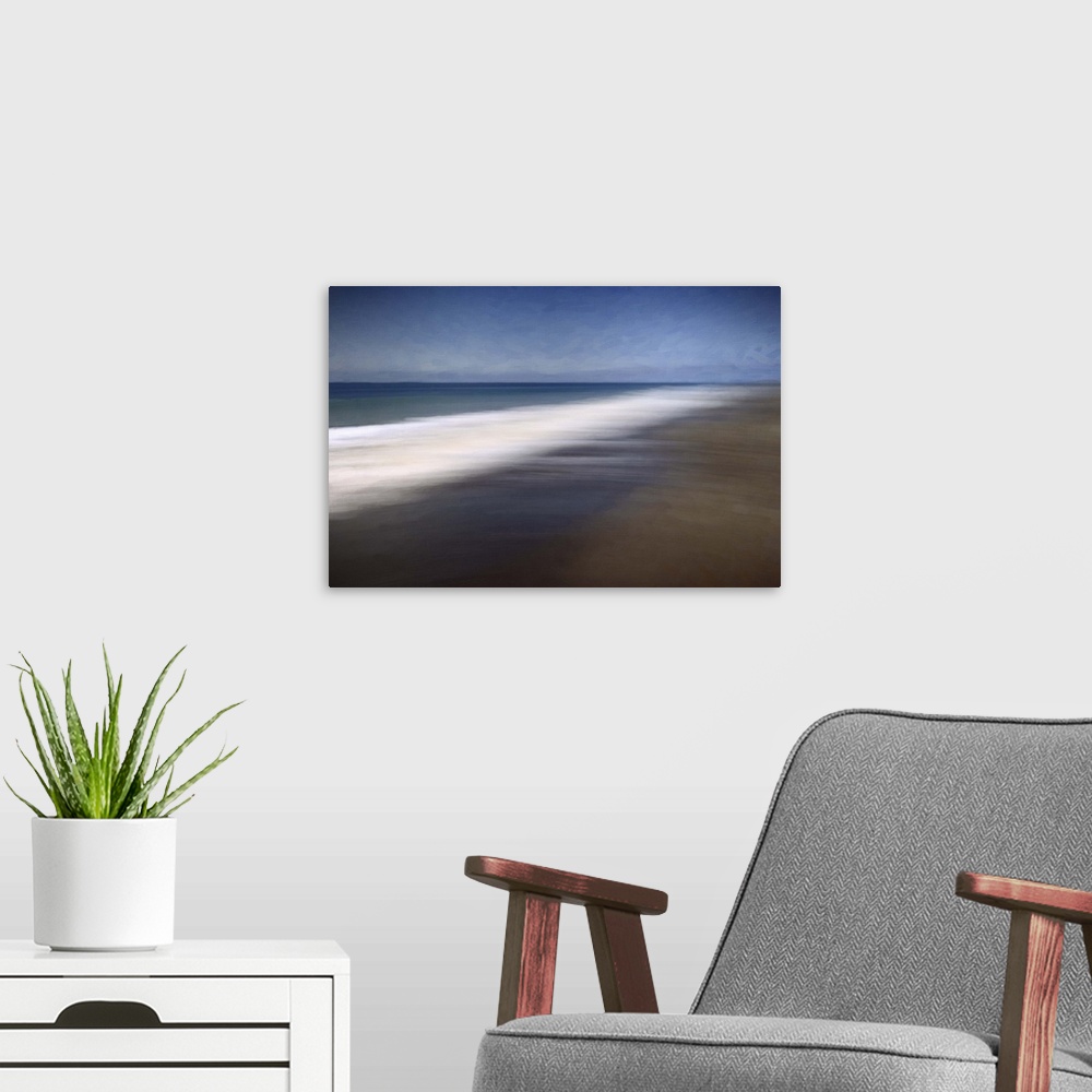 A modern room featuring Blurred long-exposure image of the foamy sea on a sandy beach, moving with the tide.