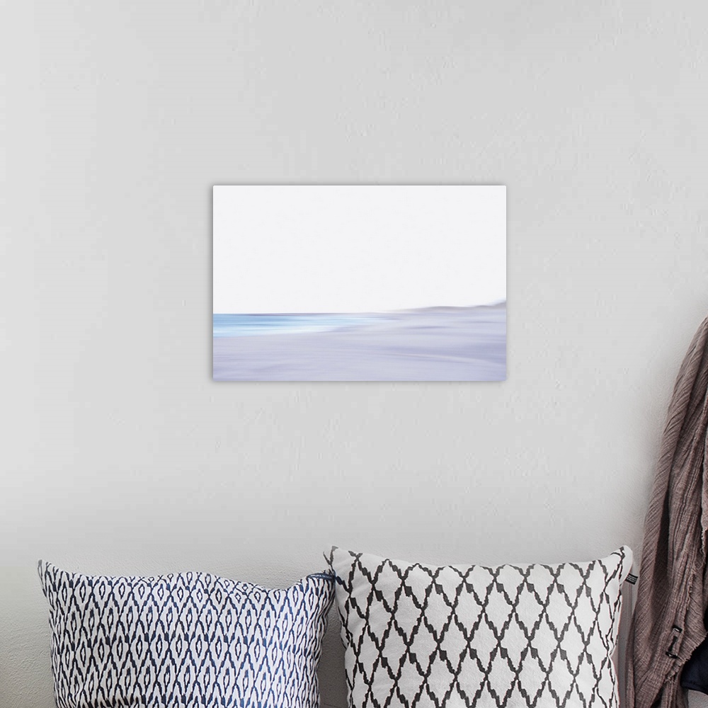 A bohemian room featuring Artistically blurred photo. The North Sea beach of North Jutland, Denmark. A seagull flies to the...