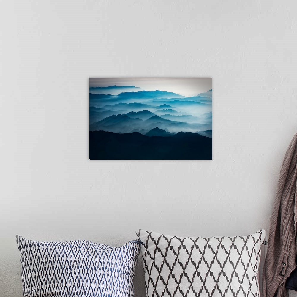A bohemian room featuring Blue mountains with mist taken from the sky, mountains of Asia