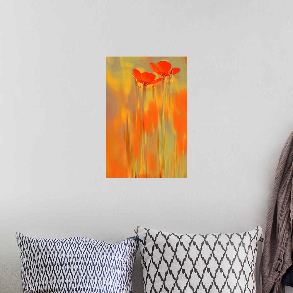 A bohemian room featuring A large vertical piece that has two long orange flowers shown surrounded by warm colors.