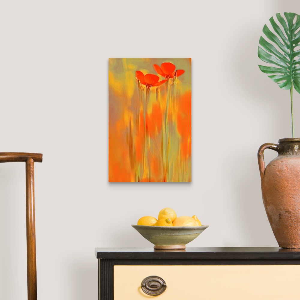 A traditional room featuring A large vertical piece that has two long orange flowers shown surrounded by warm colors.