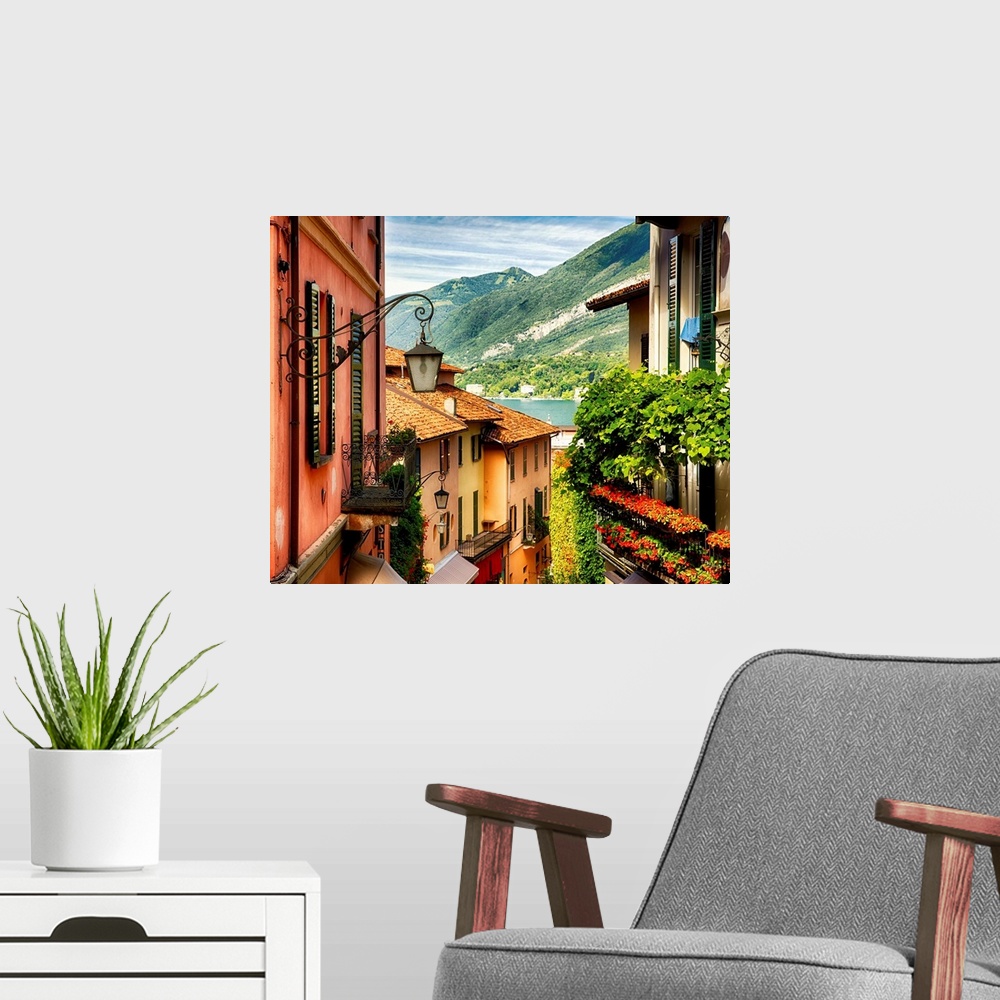 A modern room featuring Fine art photo of the roofs of shops in a European city, looking to the lake below.