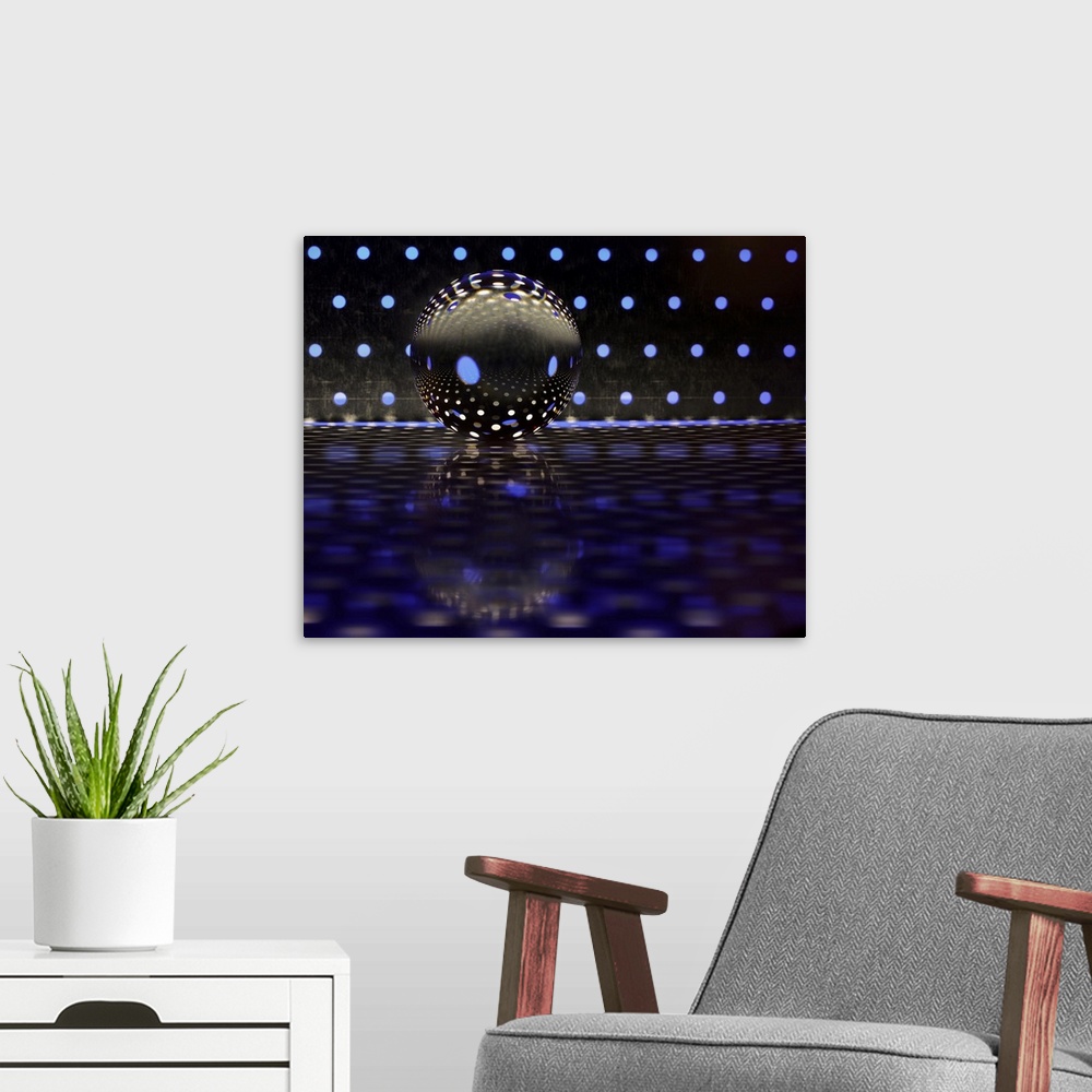A modern room featuring A glass ball on a metal plate with blue dots of color reflecting.