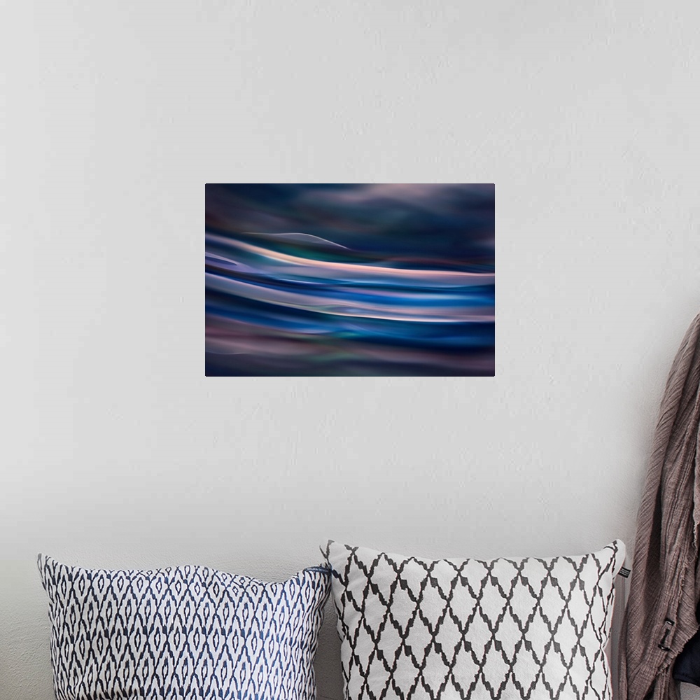 A bohemian room featuring Abstract photograph of blurred and blended colors and flowing lines in shades of blue.