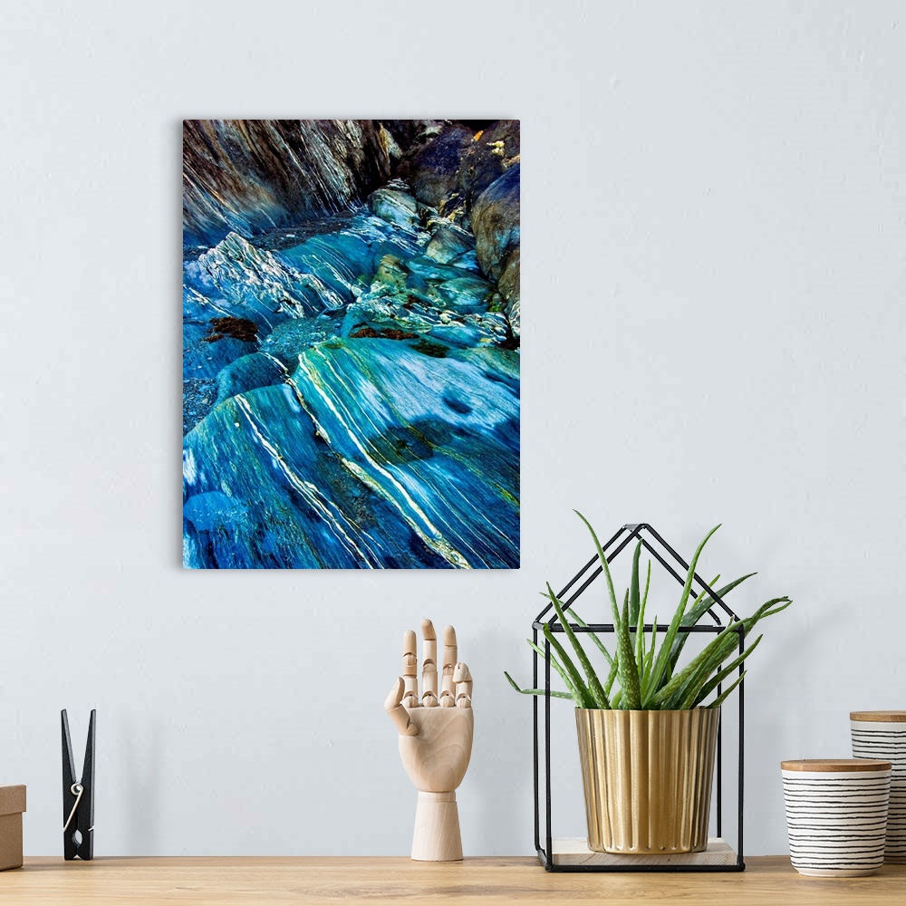 A bohemian room featuring Fine art photo of a turquoise stream flowing over a rocky riverbed.