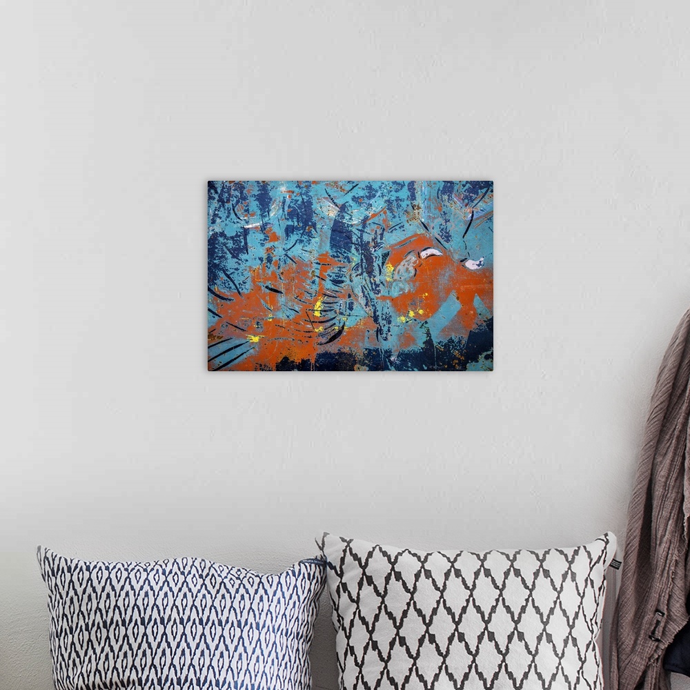 A bohemian room featuring Close up of graffiti on a wall, creating an abstract image in turquoise and orange.