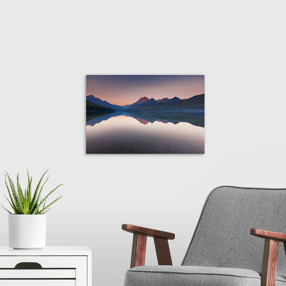 A modern room featuring Peaceful Bowman Lake in sunset at Polebridge, Glacier National Park, Montana.