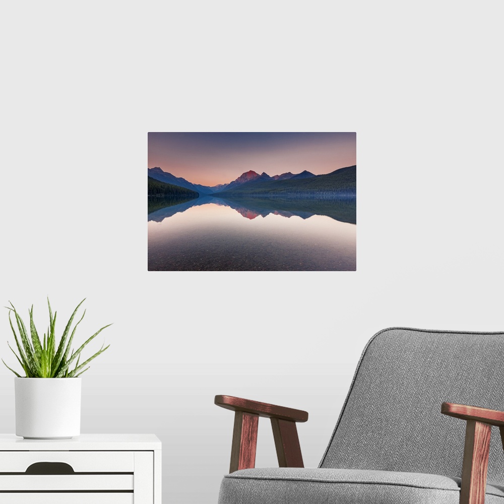A modern room featuring Peaceful Bowman Lake in sunset at Polebridge, Glacier National Park, Montana.