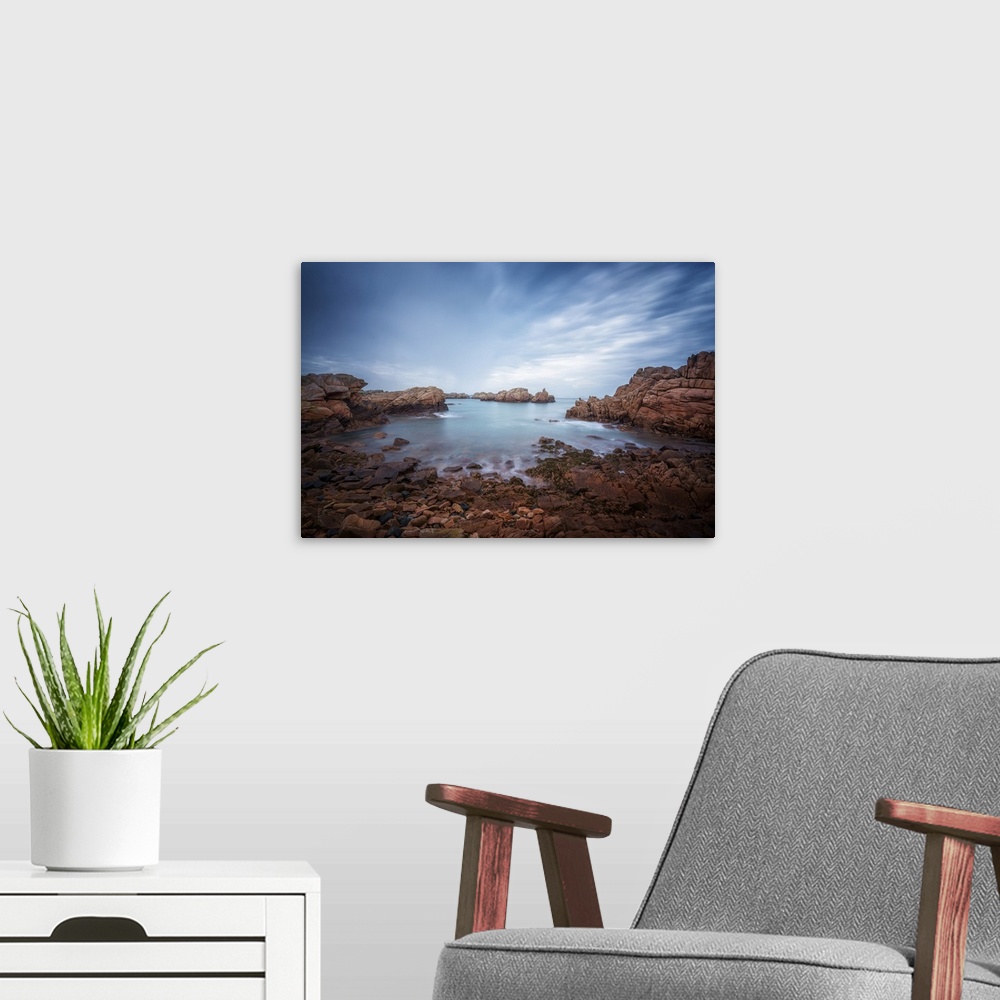 A modern room featuring Fine art photo of the rocky shoreline of an island in the north of France.
