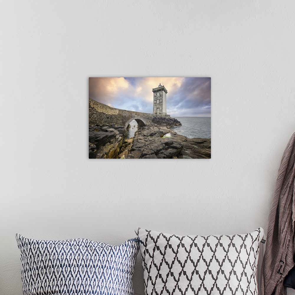 A bohemian room featuring Lighthouse on a rocky coast in France.