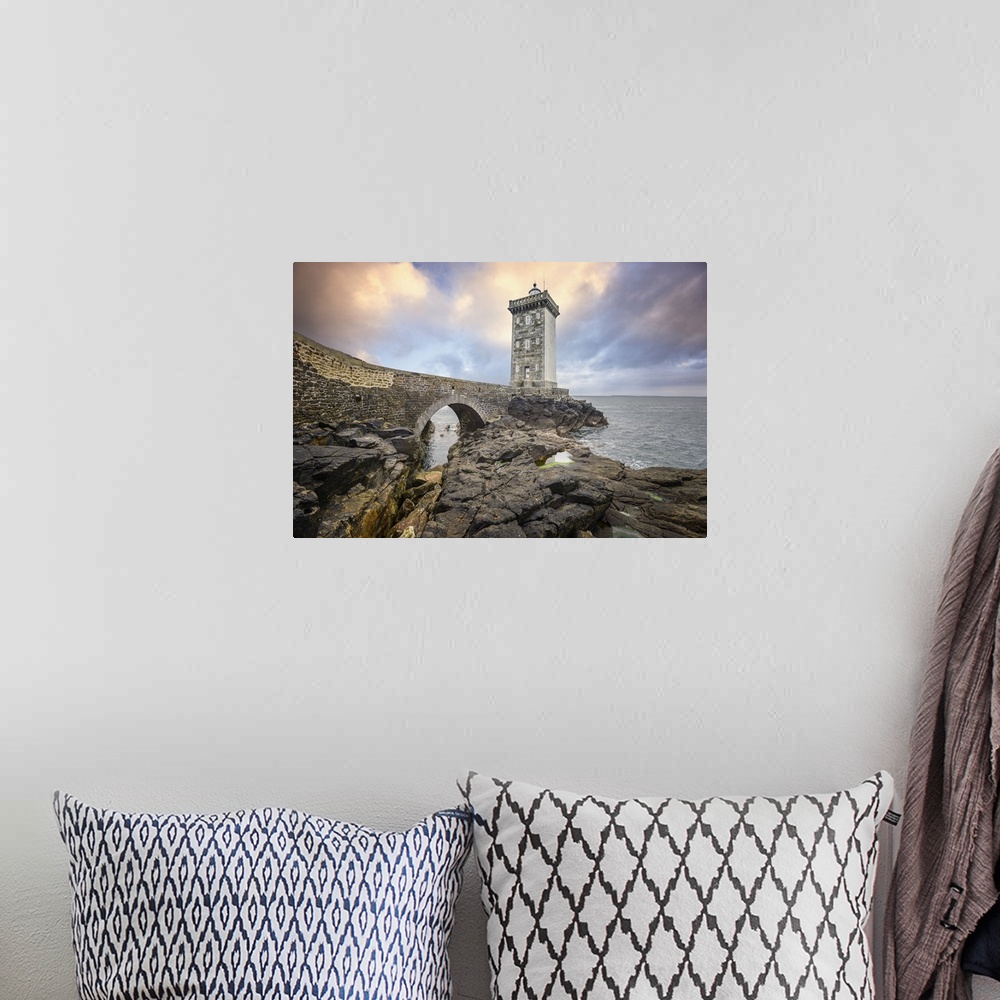A bohemian room featuring Lighthouse on a rocky coast in France.