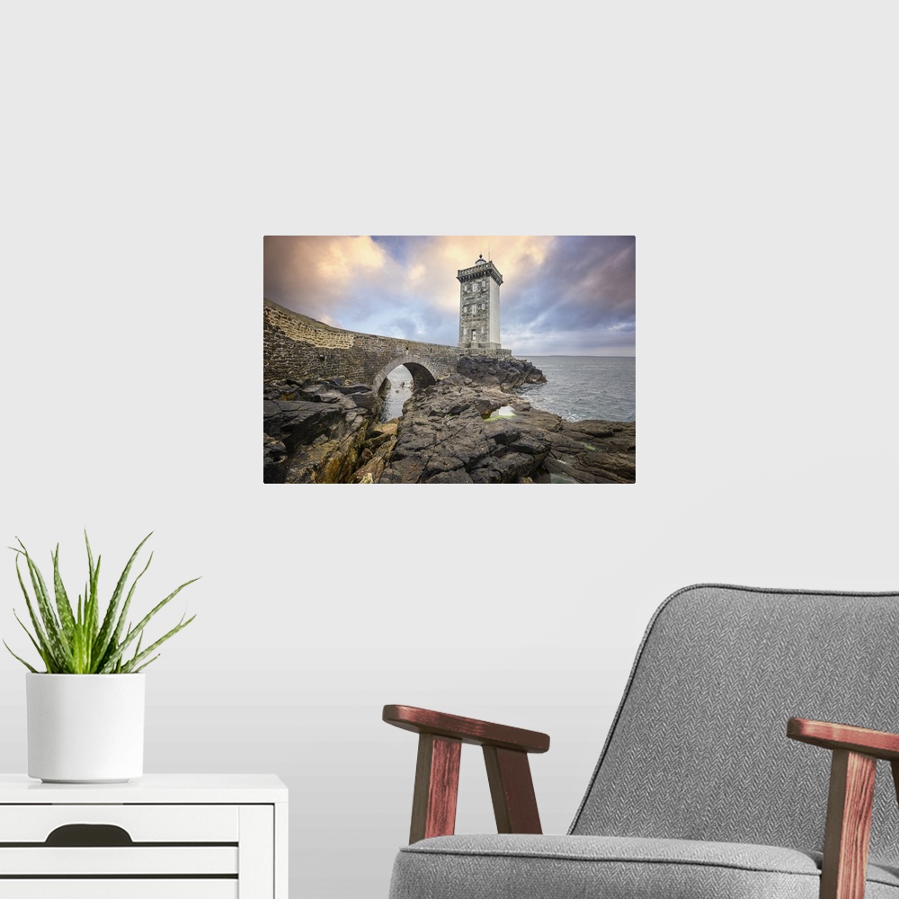 A modern room featuring Lighthouse on a rocky coast in France.