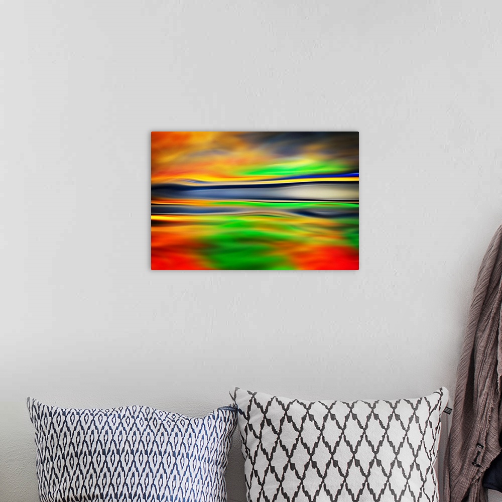 A bohemian room featuring Abstract artwork of flowing bright colors that have been blended to create subtle ripples.