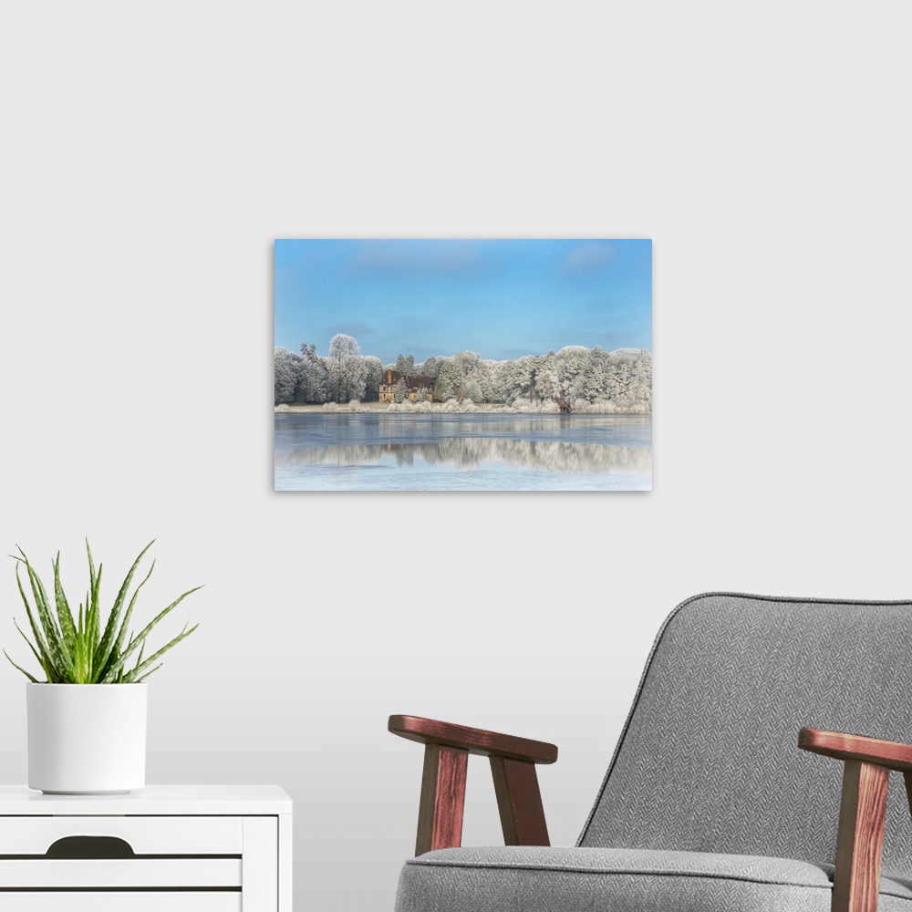 A modern room featuring Photograph of a view across the frozen pond from Broceliande Castle.