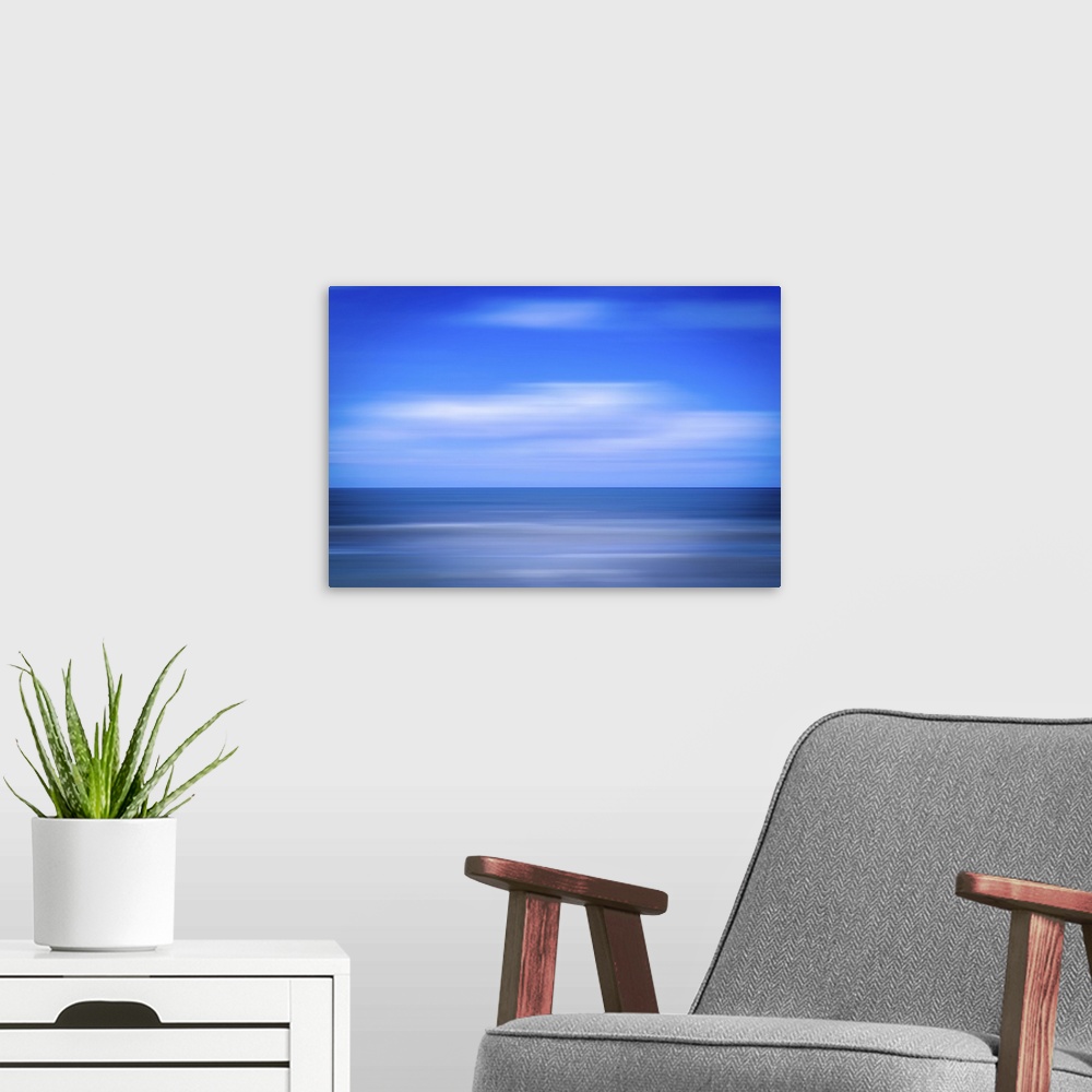 A modern room featuring An image of the sea using the ICM (Intentional Camera Movement) technique.