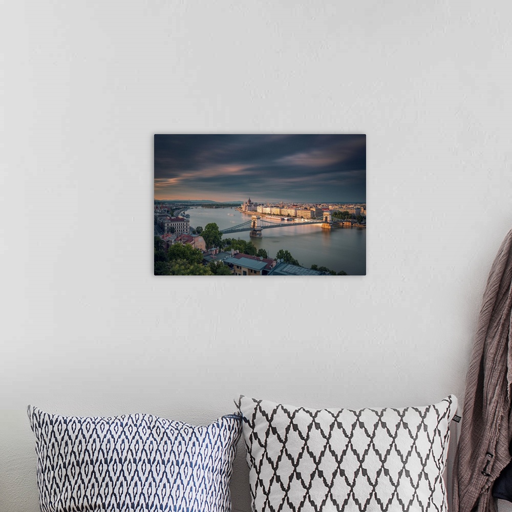 A bohemian room featuring Hungarian Parliament Building along Danube river bank seen from Buda Castle in Budapest, Hungary.