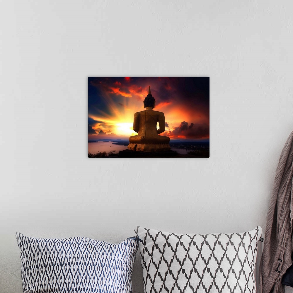 A bohemian room featuring Buddha facing the sunset